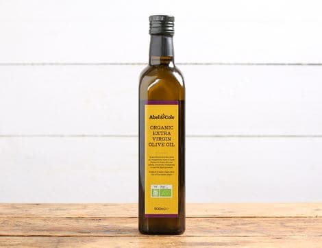Extra virgin olive oil in dark glass bottle